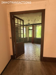 Maison ancienne avec garage et jardin